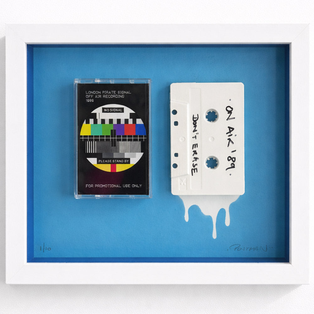 Framed mixed-media cassette artwork inspired by 1989 pirate radio, featuring a test signal tape and a hand-marked “On Air ’89” cassette on a bold blue background. THE POSTMAN